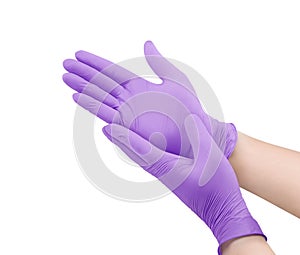 Medical nitrile gloves.Two violet surgical gloves isolated on white background with hands. Rubber glove manufacturing, human hand