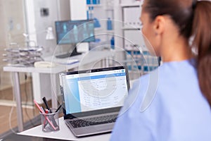 Medical nurse checking patient documentation photo