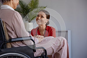 Medical nurse or social worker and elderly patient at nursing home