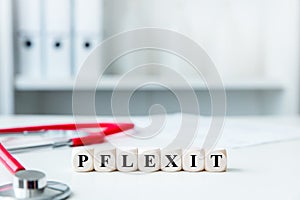 Medical office with dices, german word pflexit witch means pflege and exit photo