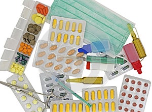 Medical pack of pills and syringe on white