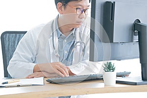 Medical person typing. Close-up of a medical worker typing on computer