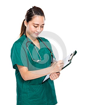 Medical person write on clipboard