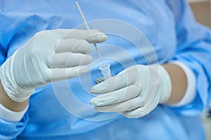 Nurse Mixing COVID-19 Rapid Test Swab photo