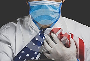 Medical personnel hugging the American flag