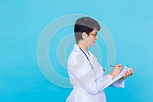 Medical physician doctor woman over blue background with copy space