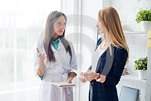 Medical physician doctor woman talking to patient