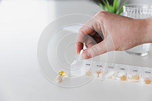 Medical pill box with tablet doses for daily take medicine with drugs, capsules