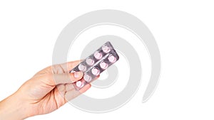 medical pills in blister in hand isolated on white background. copy space, template