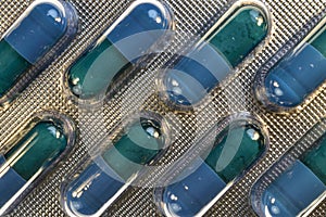 Medical pills. Blue tablet in transparet bister park