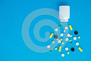 Medical Pills. Colored Pills And Capsule On Blue Background. Pharmacy Theme, Capsule Pills With Medicine Antibiotic in