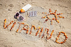 Medical pills, inscription vitamin D and accessories for sunbathing at beach, prevention of vitamin D deficiency