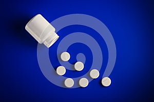 Medical pills of round shape and light color