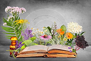 Medical plants with old books and glas bottle