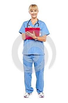 Medical practitioner posing with a clipboard