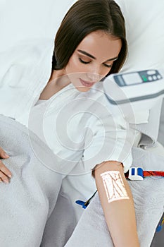 Medical Procedure. Woman Scanning Veins With Vein Finder