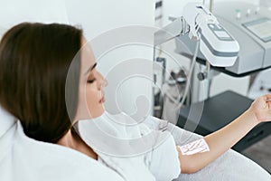 Medical Procedure. Woman Scanning Veins With Vein Finder