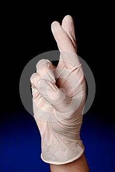 Medical profession with his/her fingers cros