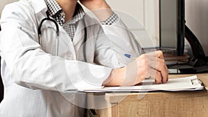 Medical professional doctor writing RX prescription on clipboard