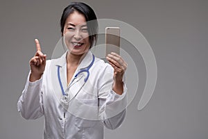 Medical professional enthusiastic about smartphone app feature