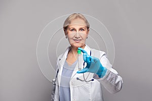 Medical professional in lab coat at studio