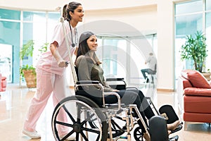 Medical Professional Leaving Young Patient In Hospital