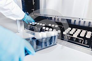 Medical professional places samples in sperm bank for storage and analysis. Concept cloning