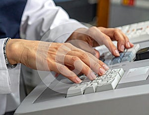 Medical Professional Using Electronic Medical Records on Keyboard