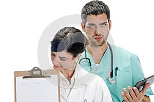 Medical professionals with paper in writing board