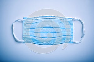 Medical protection face mask on blue background - Covid 19 protection