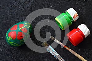 Medical protective face mask and colorful easter eggs isolated on black background.