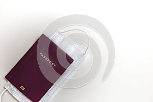 medical protective mask and passport on white background. Concept travel and tourism in the pandemic Covid-19