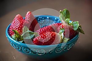 Natural background of red strawberries on the table ready to eat photo