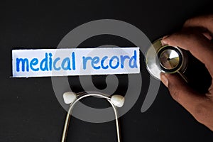 Medical record inscription with the view of stethoscope