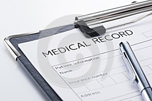 Medical record and pen on white background.