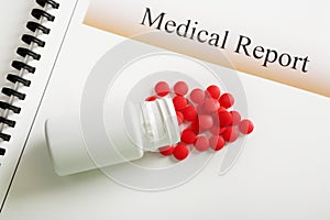Medical Report Red Tablets and Pill bottle