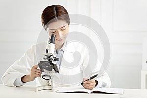 Medical or scientific researcher working in lab