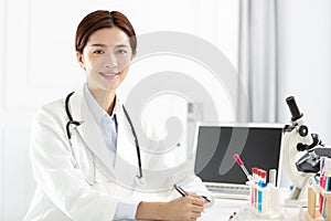 medical or scientific researcher working in office