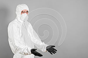 A medical scientist or a police officer in riot gear pointing to an empty space. The concept of health and crime