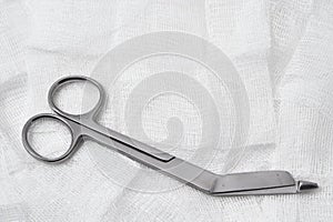 Medical scissors and gauze.