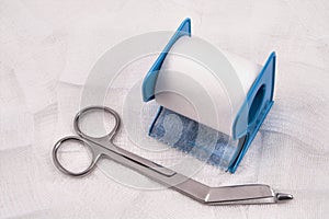 Medical scissors, gauze and tape