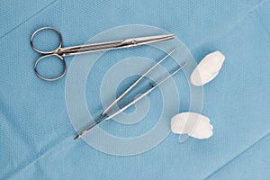 Medical scissors, tweezers and swabs photo