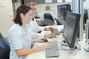 Medical secretaries browsing files