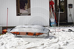 medical sled on a downhill slope for tramping downhill skiers and snowboarders. photo