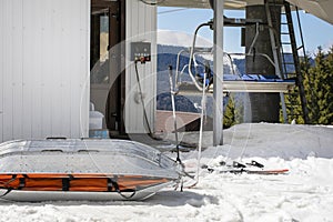 medical sled on a downhill slope for tramping downhill skiers and snowboarders. photo