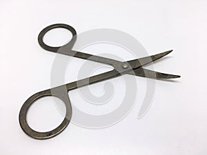 medical small metal scissors for cutting bandages and seams, isolated on white background