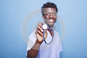 Medical specialist grasping stethoscope