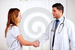 Medical specialist greeting a beautiful patient