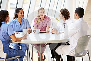 Medical Staff Chatting In Modern Hospital Canteen photo