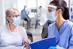 Medical staff with disabled woman